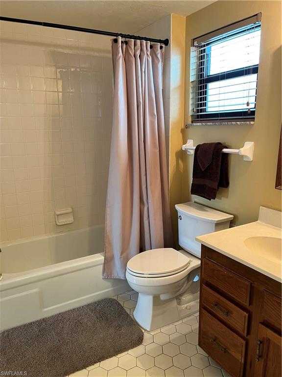 807 River Point Drive, Unit 304D Naples, FL 34102 - Photo 17 of 23 a bathroom with a sink toilet and shower