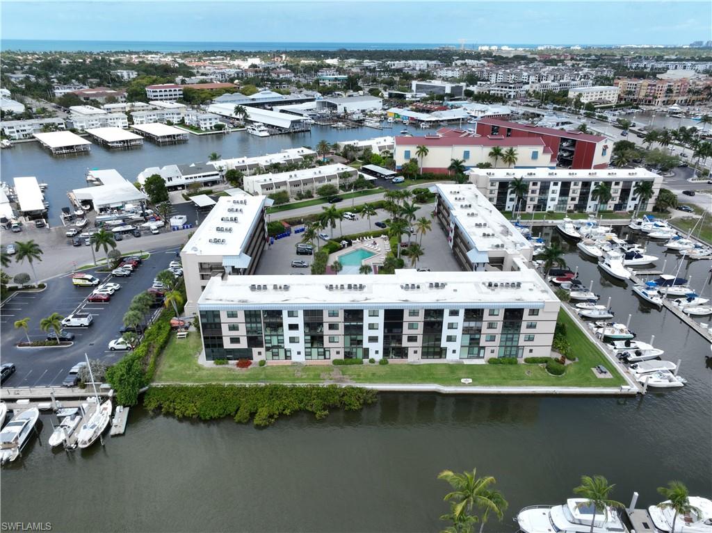 807 River Point Drive, Unit 304D Naples, FL 34102 - Photo 22 of 23 an aerial view of a house with a lake view