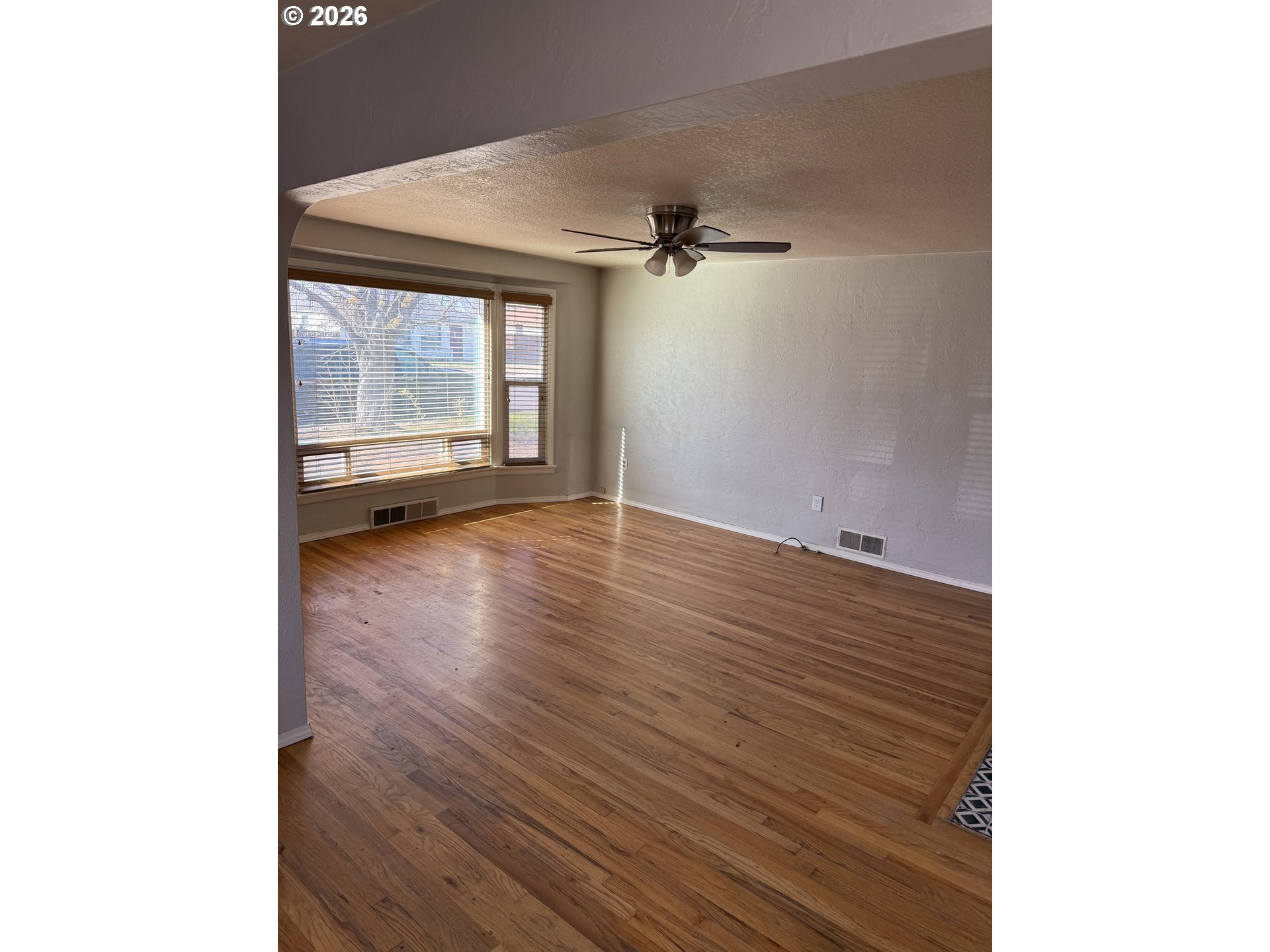 225 Southwest 7th Place Hermiston, OR 97838 - Photo 4 of 13 a view of an empty room with a window