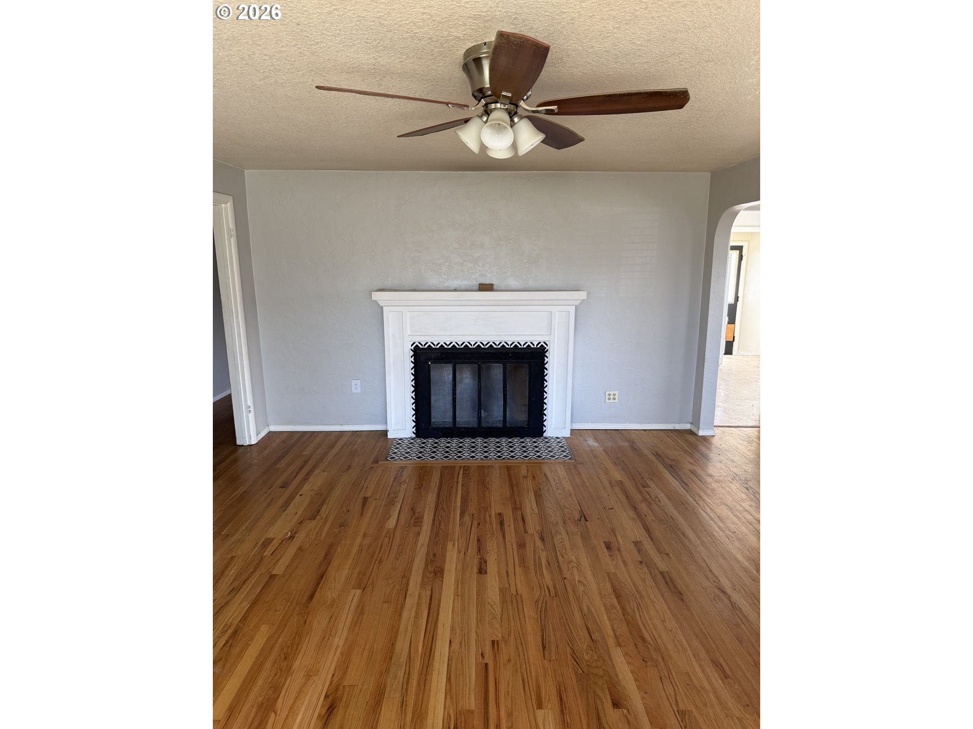 225 Southwest 7th Place Hermiston, OR 97838 - Photo 5 of 13 a view of an empty room with wooden floor