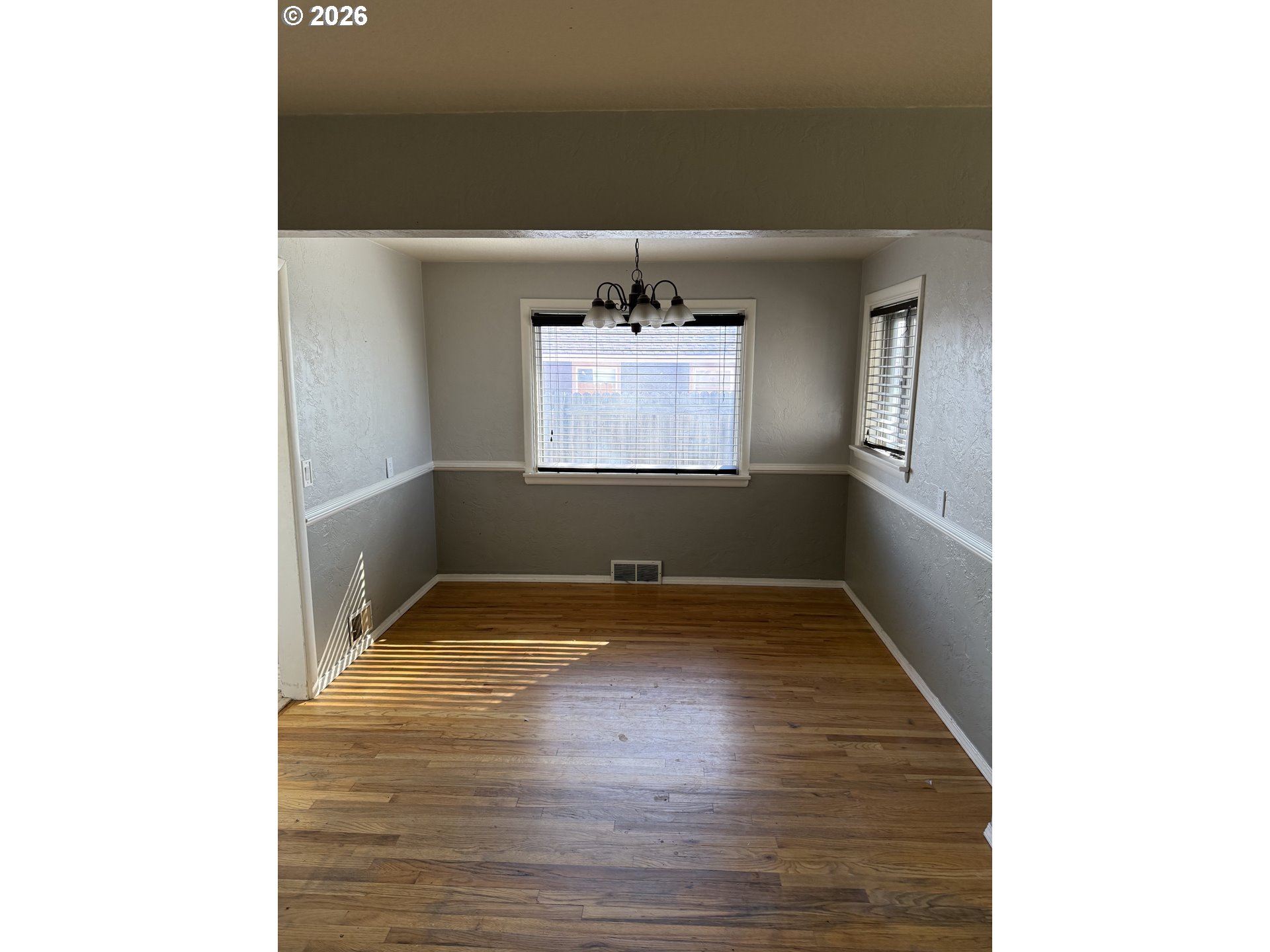 225 Southwest 7th Place Hermiston, OR 97838 - Photo 6 of 13 a view of a hallway with wooden floor