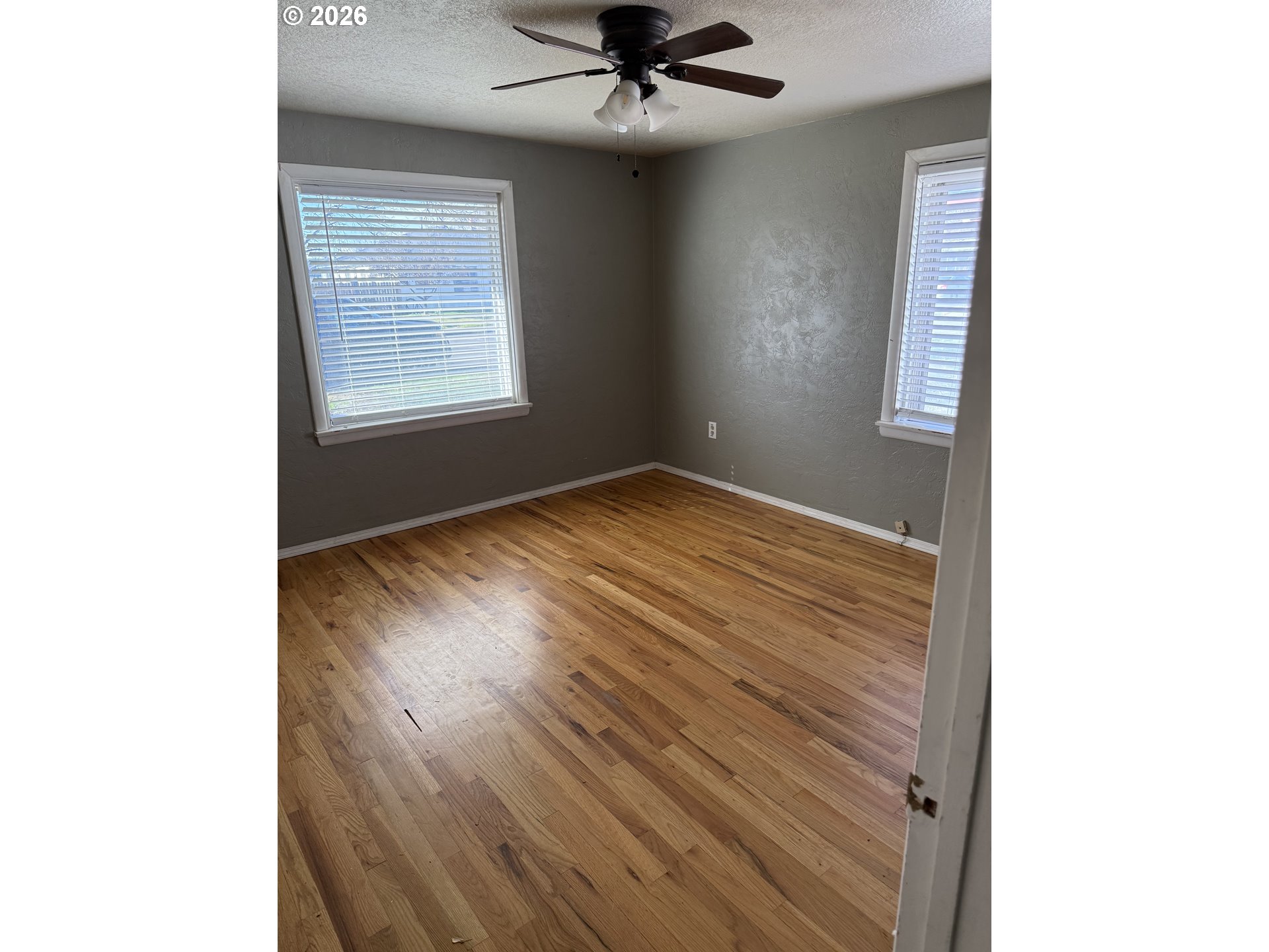225 Southwest 7th Place Hermiston, OR 97838 - Photo 7 of 13 a view of an empty room with a window