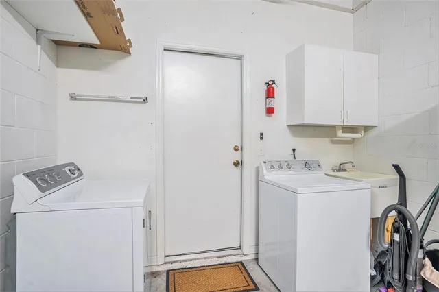 a utility room with dryer and washer