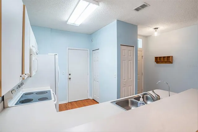 a bedroom with a bed and a large mirror