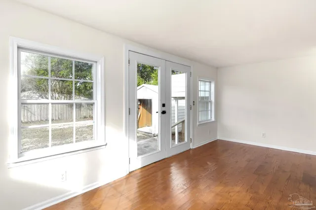 an empty room with windows and view