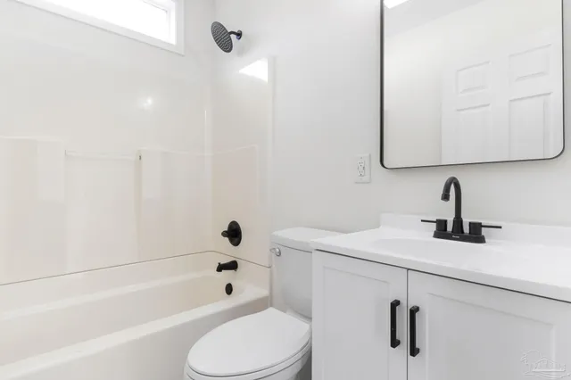a bathroom with a sink a toilet and a bathtub