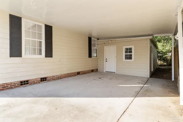 a view of a house with a backyard