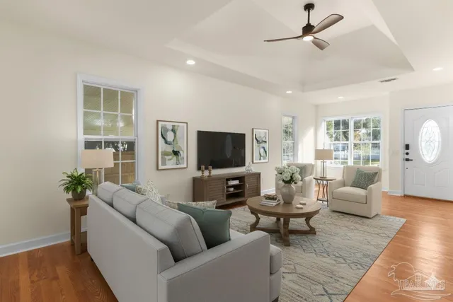 a living room with furniture and a flat screen tv