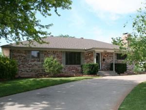 6321 Elmhurst Road Amarillo, TX 79106 - Photo 1 of 1 front view of house with a yard