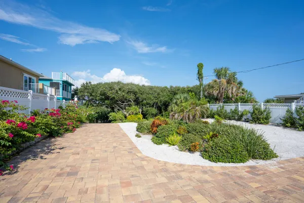 a view of a house with wooden deck