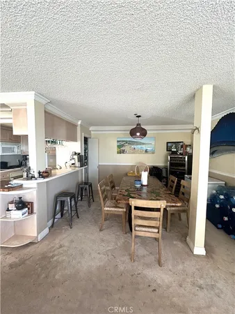 a kitchen with a stove and a refrigerator