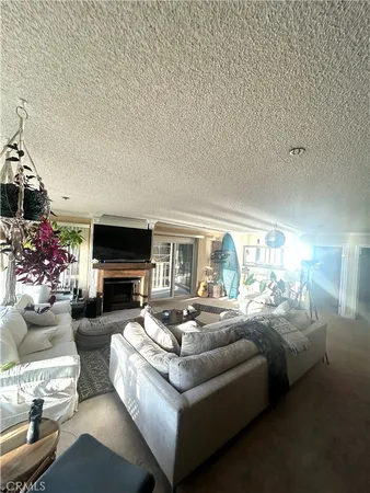 a living room with fireplace furniture and a fireplace