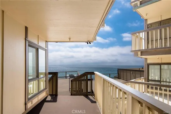 a view of balcony with furniture