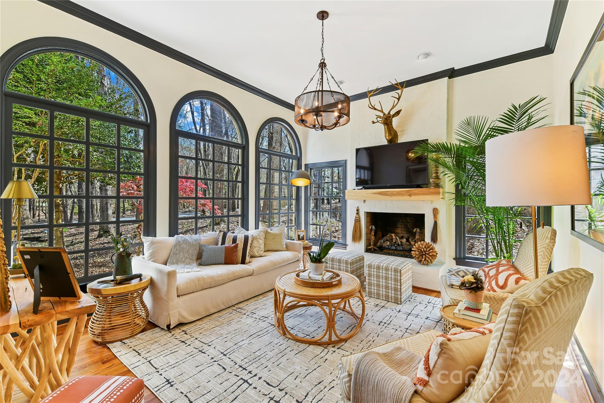 3023 High Ridge Road Charlotte, NC 28270 - Photo 13 of 48 a living room with furniture a fireplace and a chandelier