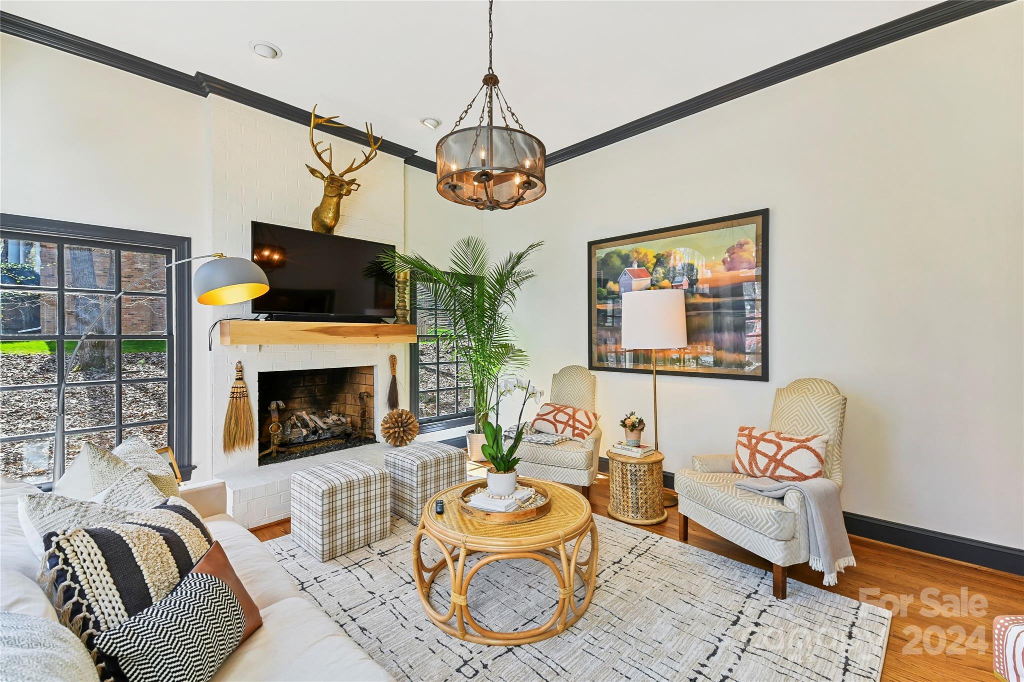 3023 High Ridge Road Charlotte, NC 28270 - Photo 14 of 48 a living room with furniture a flat screen tv and a fireplace