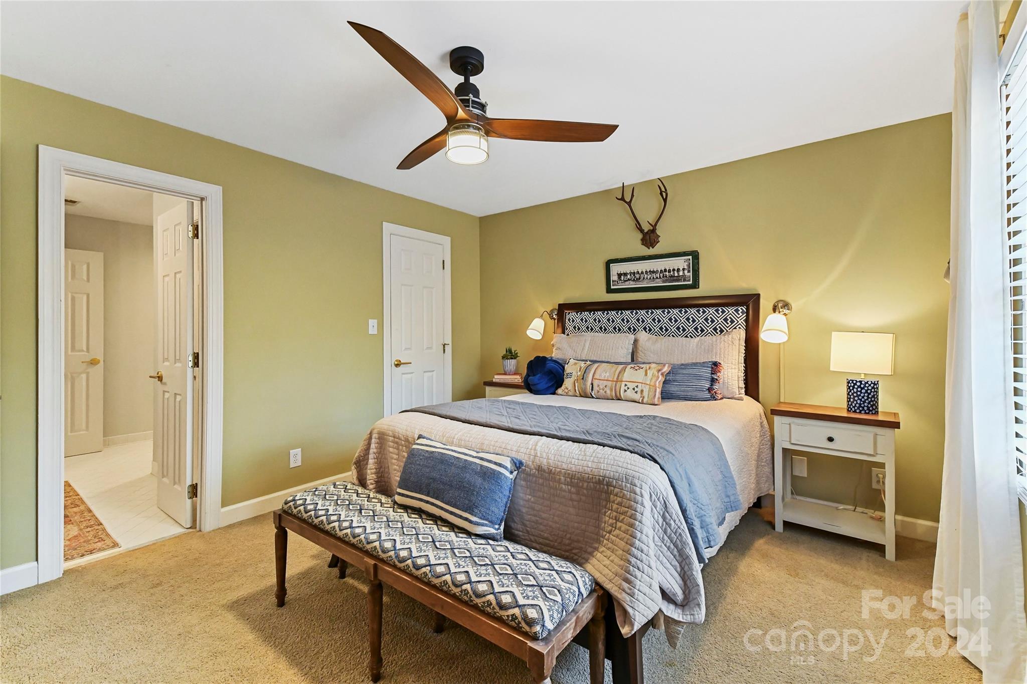 3023 High Ridge Road Charlotte, NC 28270 - Photo 31 of 48 a bedroom with a bed and a chandelier