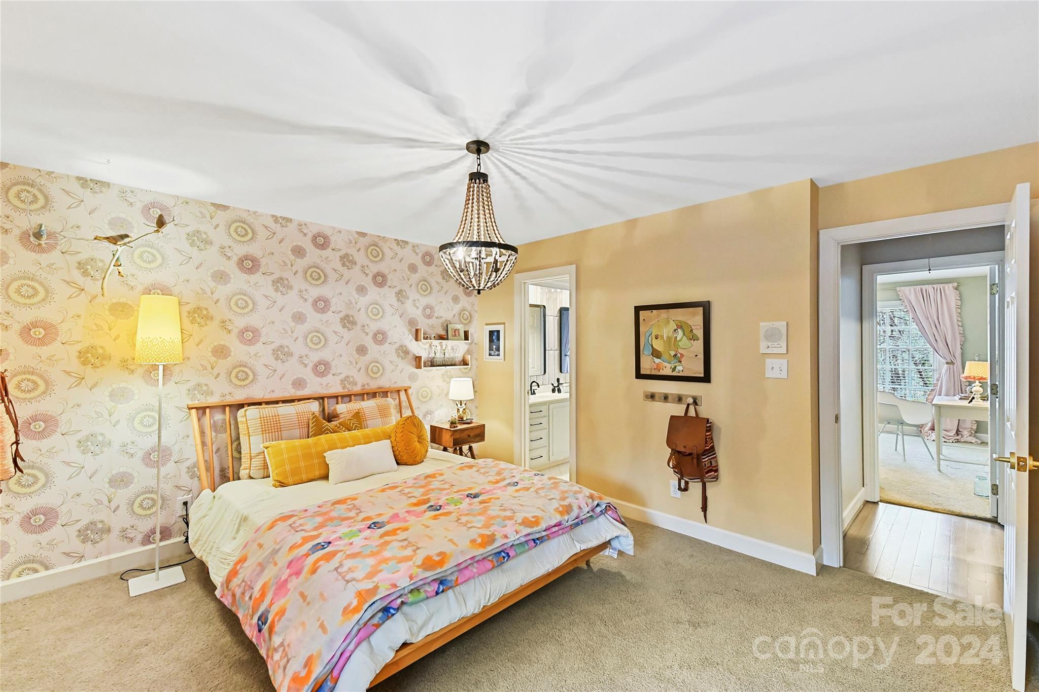 3023 High Ridge Road Charlotte, NC 28270 - Photo 34 of 48 a bedroom with a bed and a chandelier