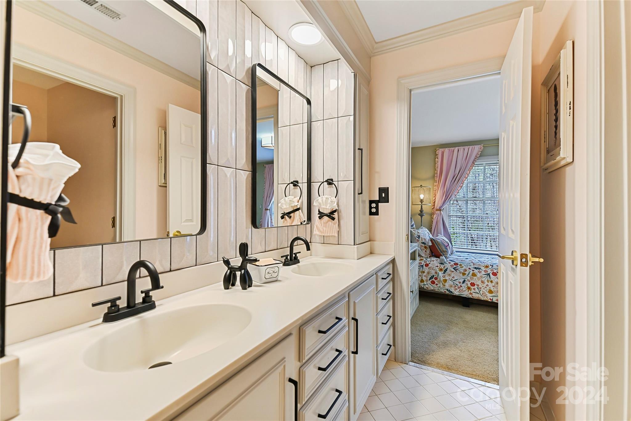 3023 High Ridge Road Charlotte, NC 28270 - Photo 35 of 48 a bathroom with a double vanity sink and mirror