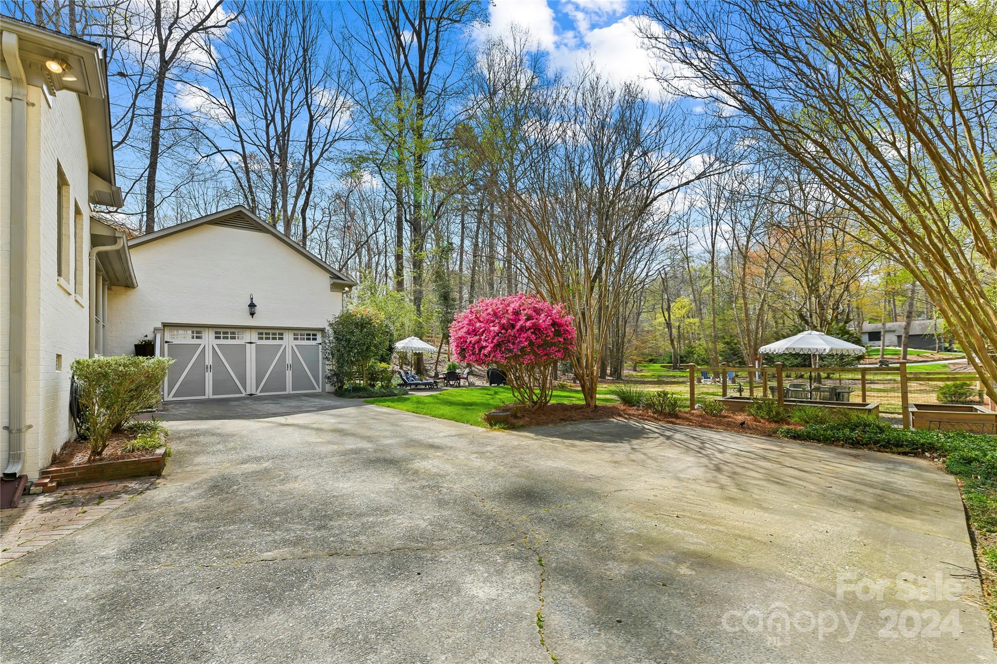 3023 High Ridge Road Charlotte, NC 28270 - Photo 42 of 48 a front view of a house with garden