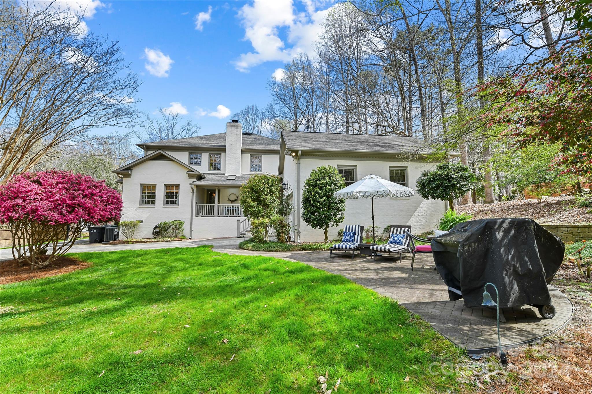 3023 High Ridge Road Charlotte, NC 28270 - Photo 44 of 48 a view of a chairs and tables in the back yard of the house