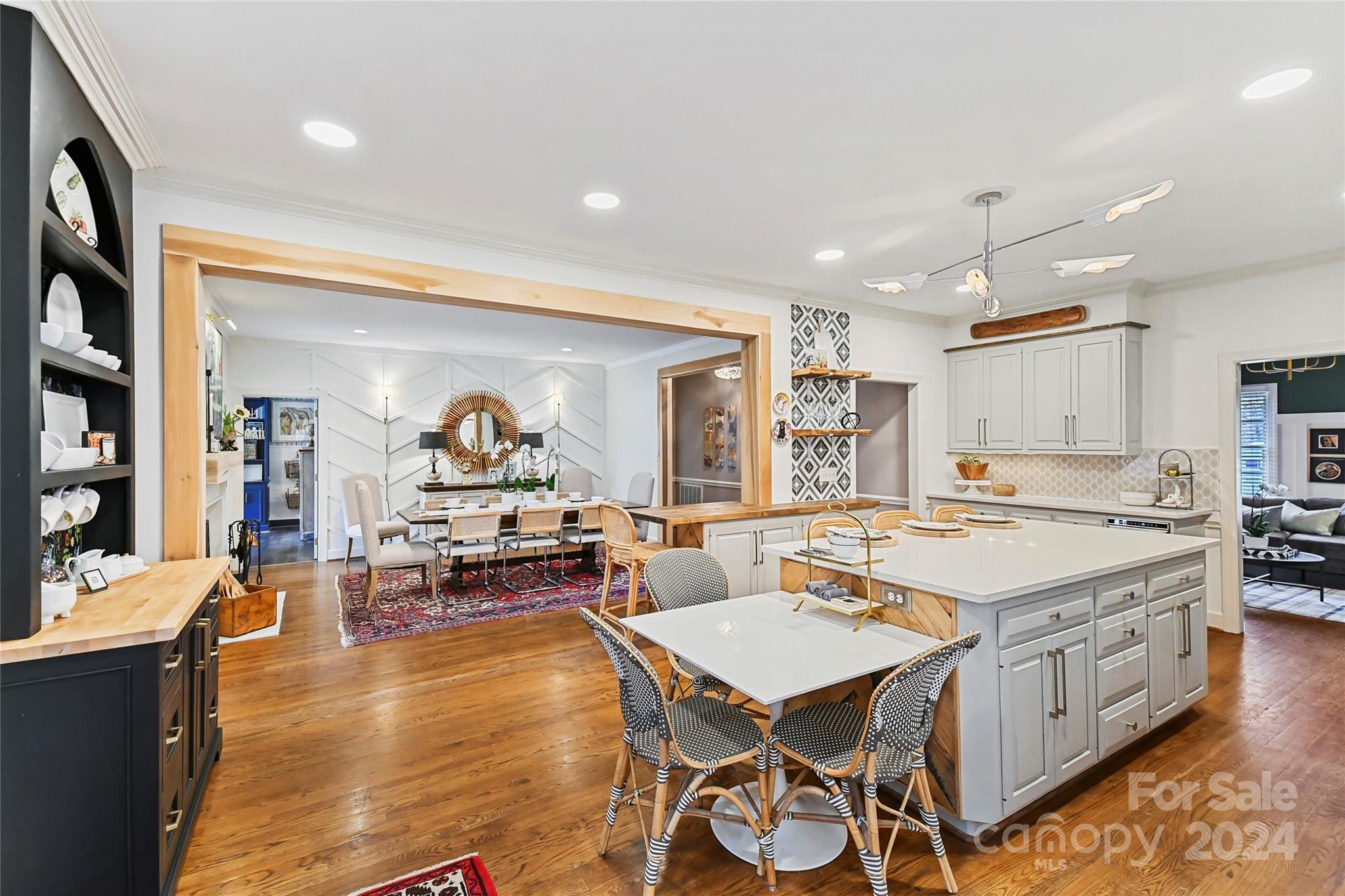 3023 High Ridge Road Charlotte, NC 28270 - Photo 5 of 48 a living room with stainless steel appliances furniture a rug and a kitchen view