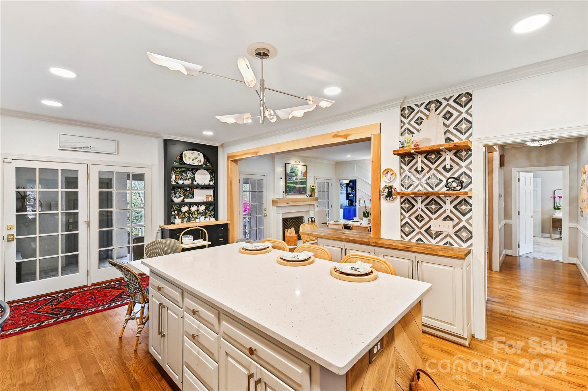 3023 High Ridge Road Charlotte, NC 28270 - Photo 6 of 48 a view of a dining room with furniture a chandelier and wooden floor