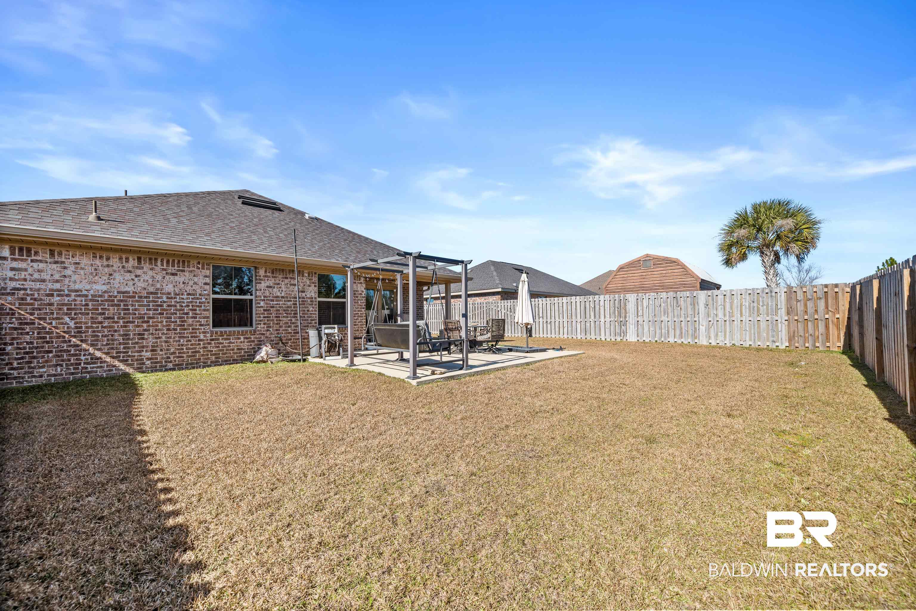 17100 Cold Mill Loop Foley, AL 36535 - Photo 22 of 27 Fenced backyard featuring a patio