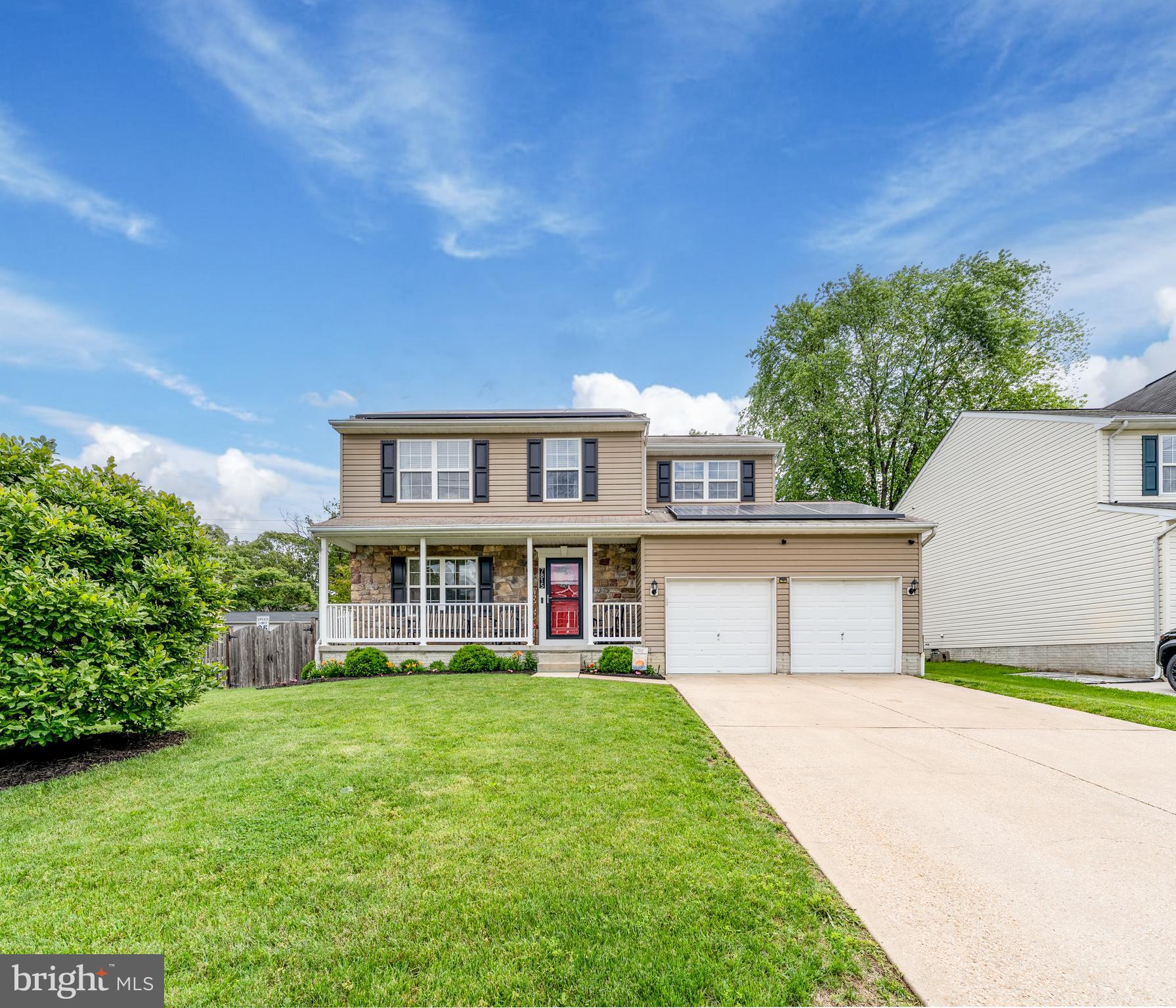front view of a house with a big yard