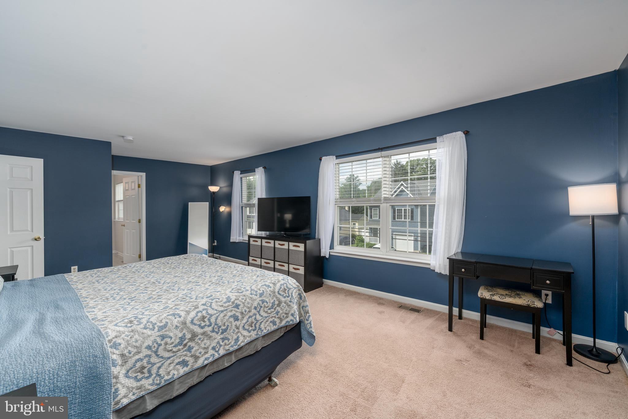 7815 Outing Avenue Pasadena, MD 21122 - Photo 17 of 37 a bedroom with a bed and a television