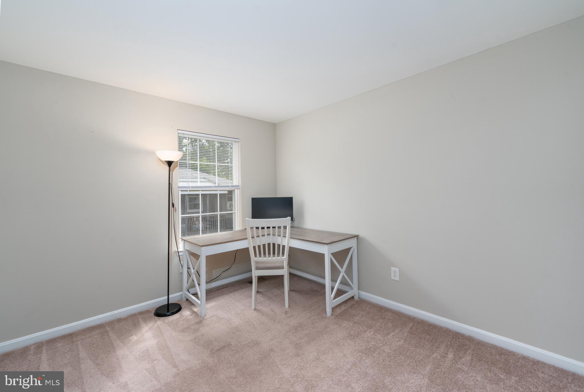 7815 Outing Avenue Pasadena, MD 21122 - Photo 22 of 37 a view of a workspace with furniture
