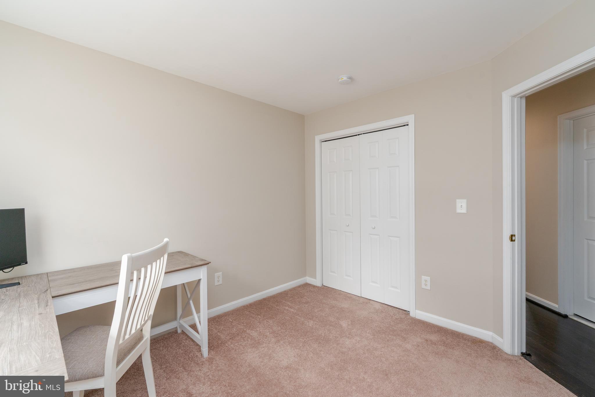 7815 Outing Avenue Pasadena, MD 21122 - Photo 23 of 37 a view of a room with table and chair