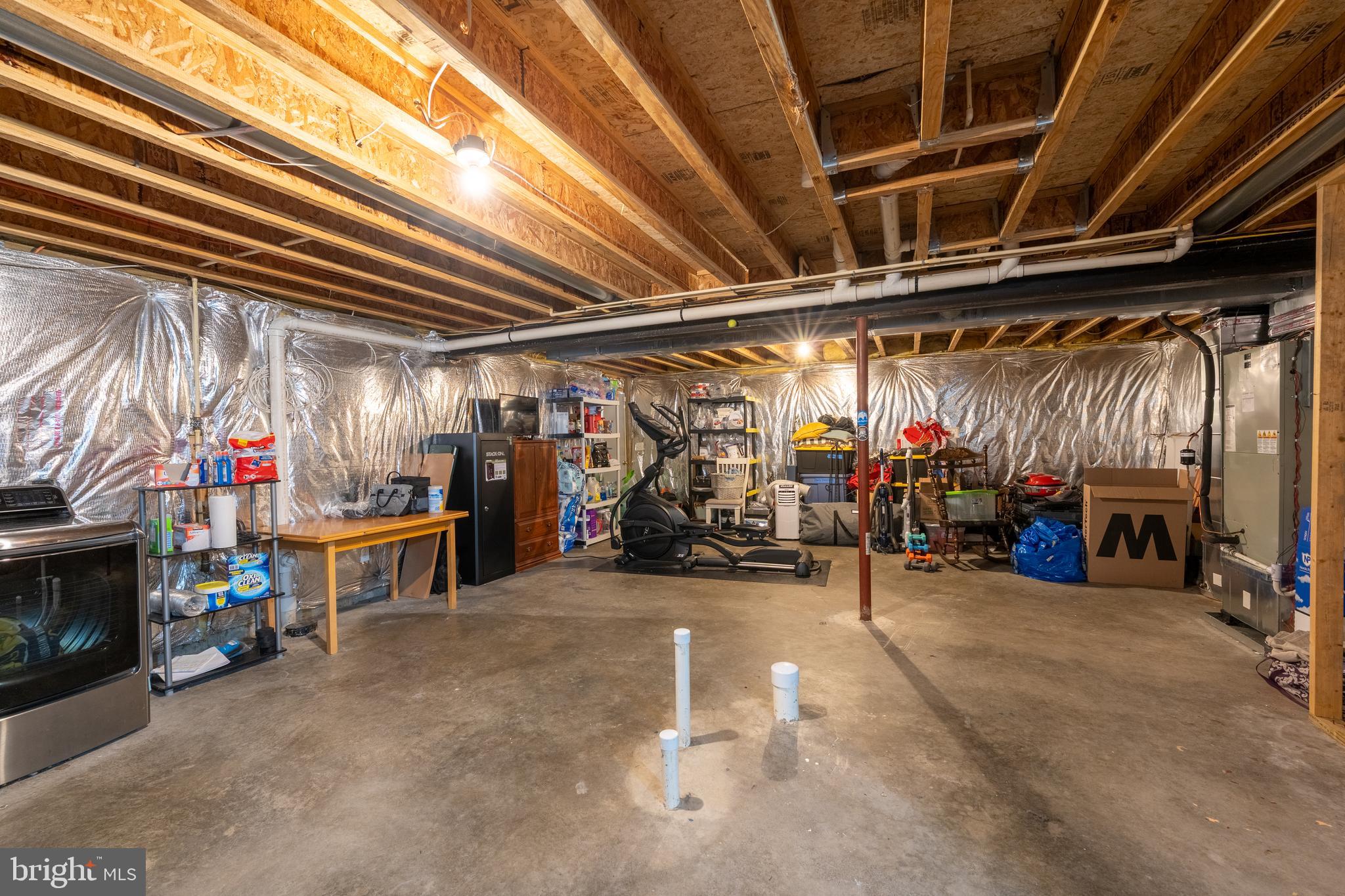 7815 Outing Avenue Pasadena, MD 21122 - Photo 25 of 37 a view of a garage with a bike and car