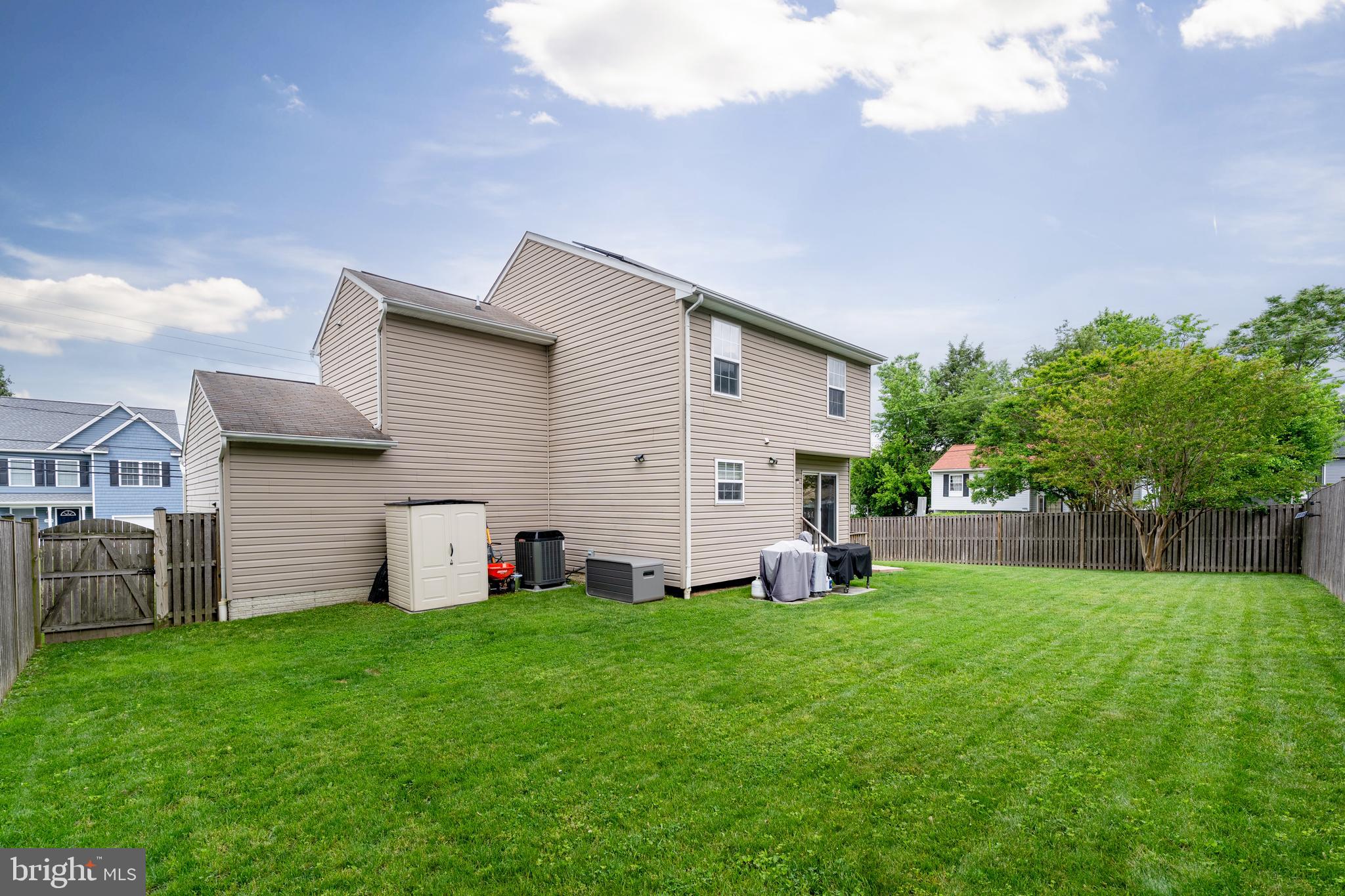 7815 Outing Avenue Pasadena, MD 21122 - Photo 29 of 37 a view of a backyard with a garden and tree
