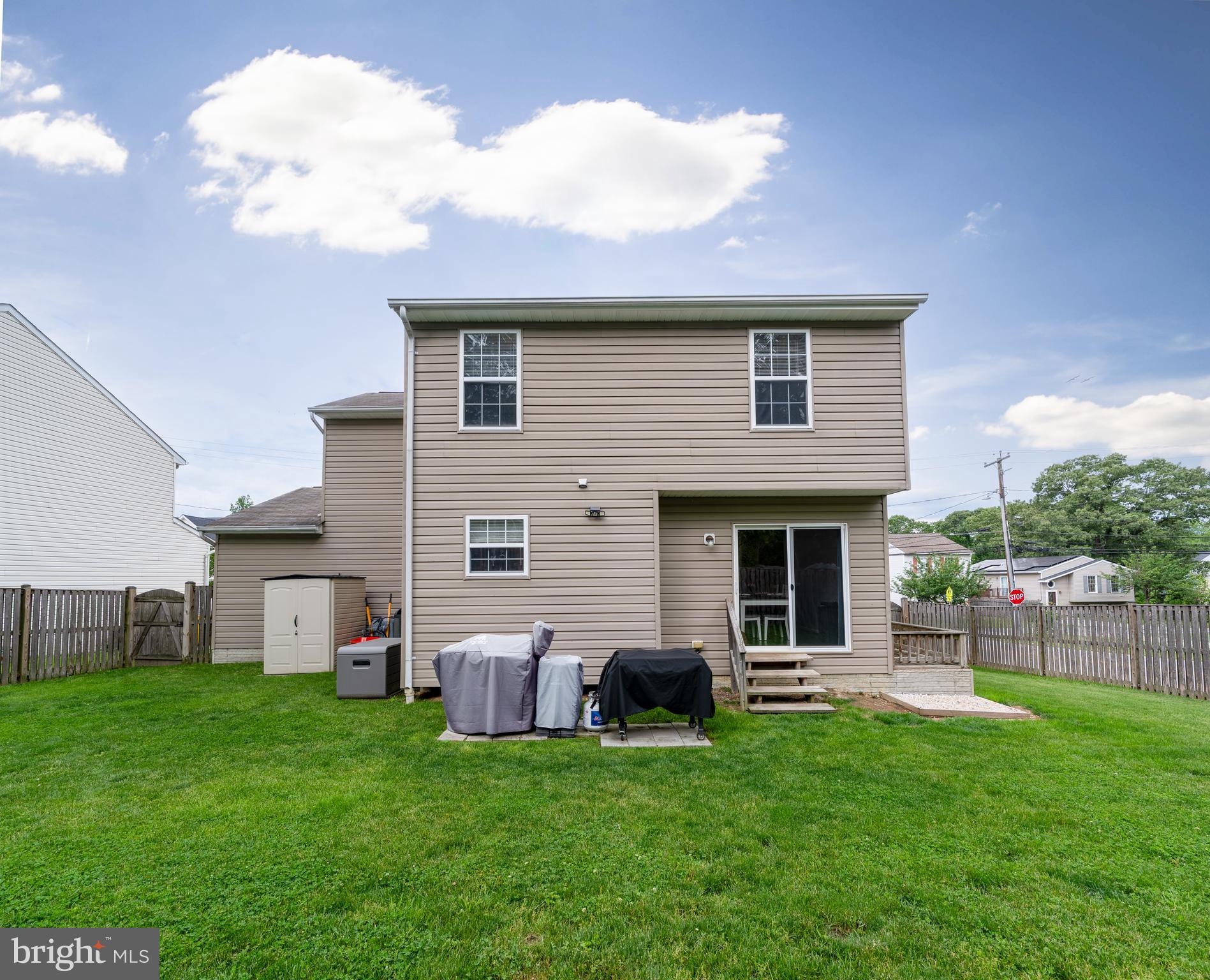 7815 Outing Avenue Pasadena, MD 21122 - Photo 30 of 37 a view of a house with a backyard