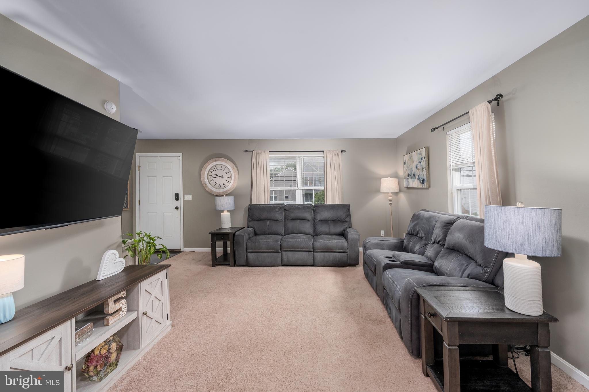 7815 Outing Avenue Pasadena, MD 21122 - Photo 3 of 37 a living room with furniture and a flat screen tv
