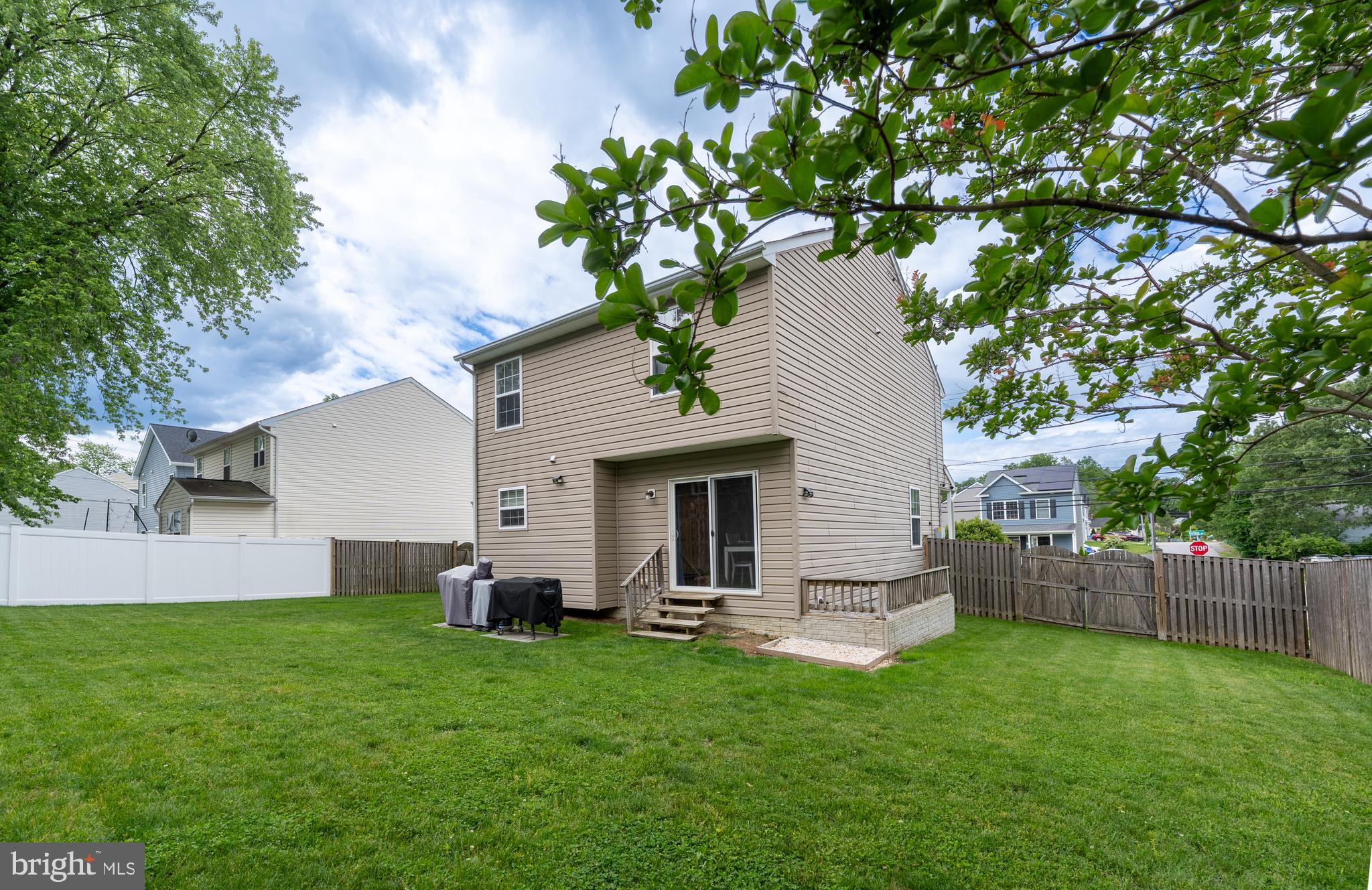 7815 Outing Avenue Pasadena, MD 21122 - Photo 31 of 37 a view of a house with backyard and a garden