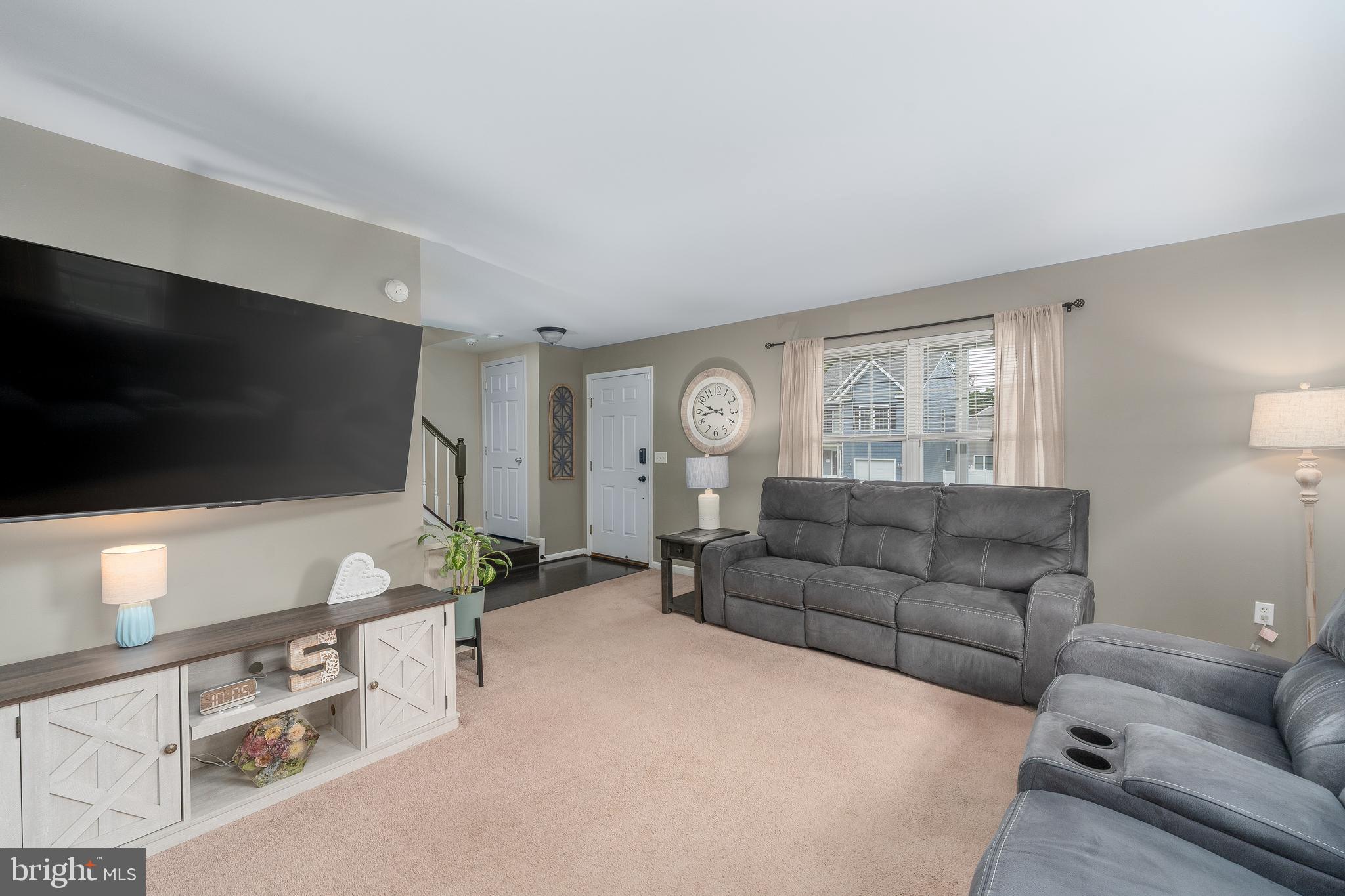 7815 Outing Avenue Pasadena, MD 21122 - Photo 4 of 37 a living room with furniture and a flat screen tv