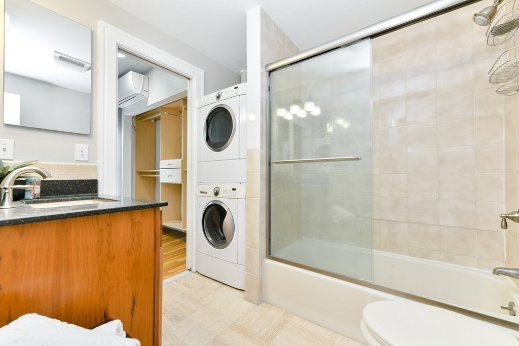 27 Concord Square, Unit 4 Boston, MA 02118 - Photo 7 of 8 a bathroom with a sink a bathtub and a shower
