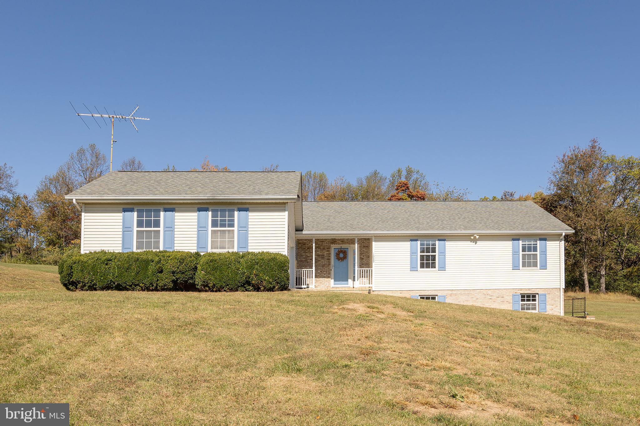 1039 Hiatt Road Clear Brook, VA 22624 - Photo 1 of 55 a front view of a house with a yard