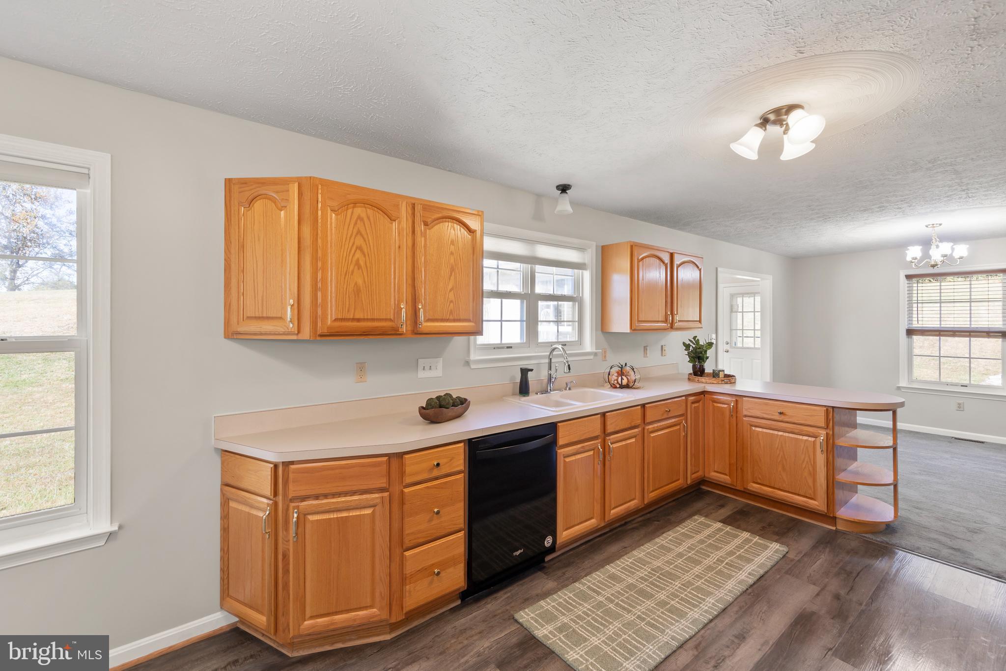 1039 Hiatt Road Clear Brook, VA 22624 - Photo 19 of 55 a kitchen with stainless steel appliances granite countertop a sink and cabinets