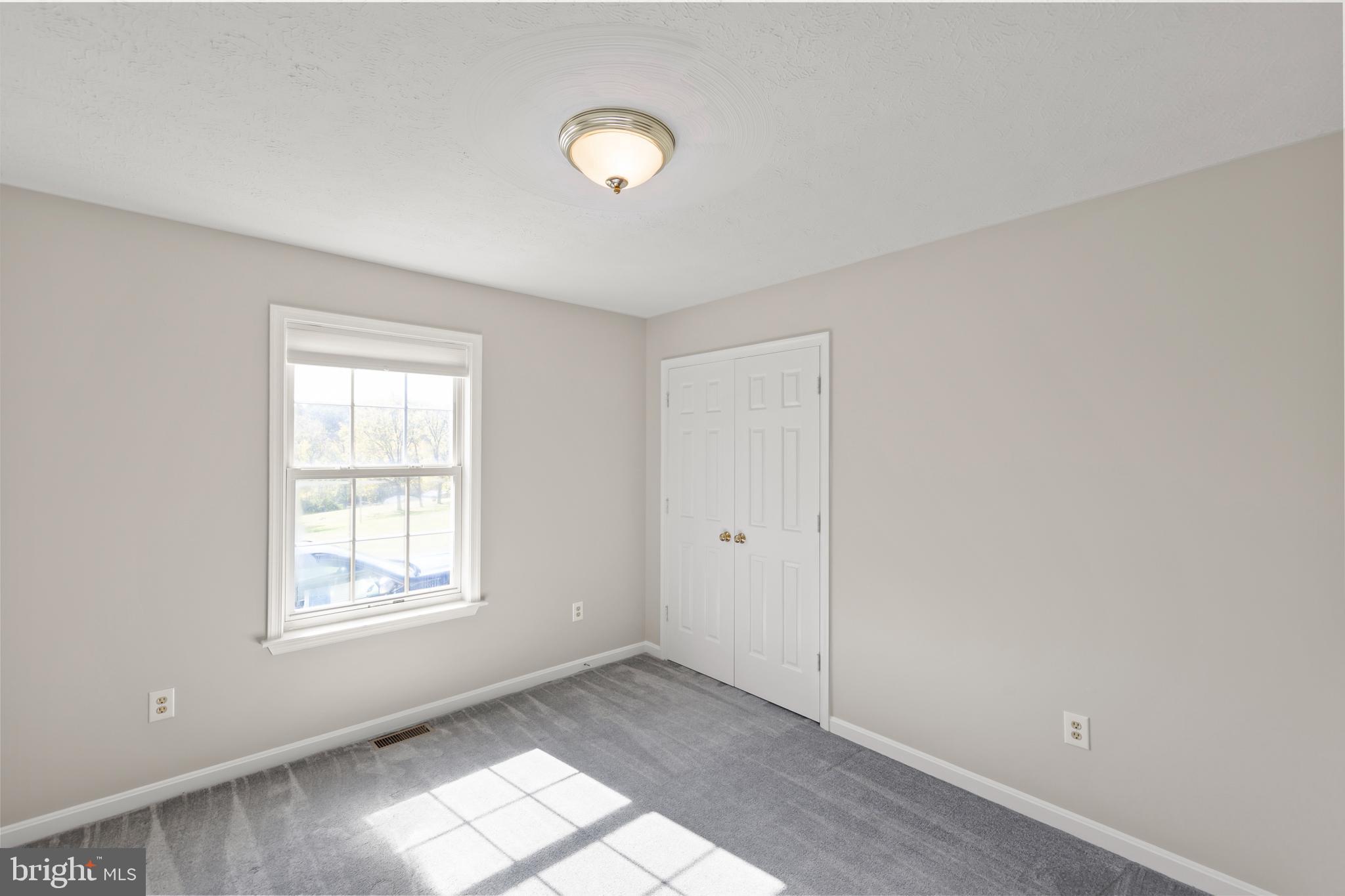 1039 Hiatt Road Clear Brook, VA 22624 - Photo 23 of 55 an empty room with windows