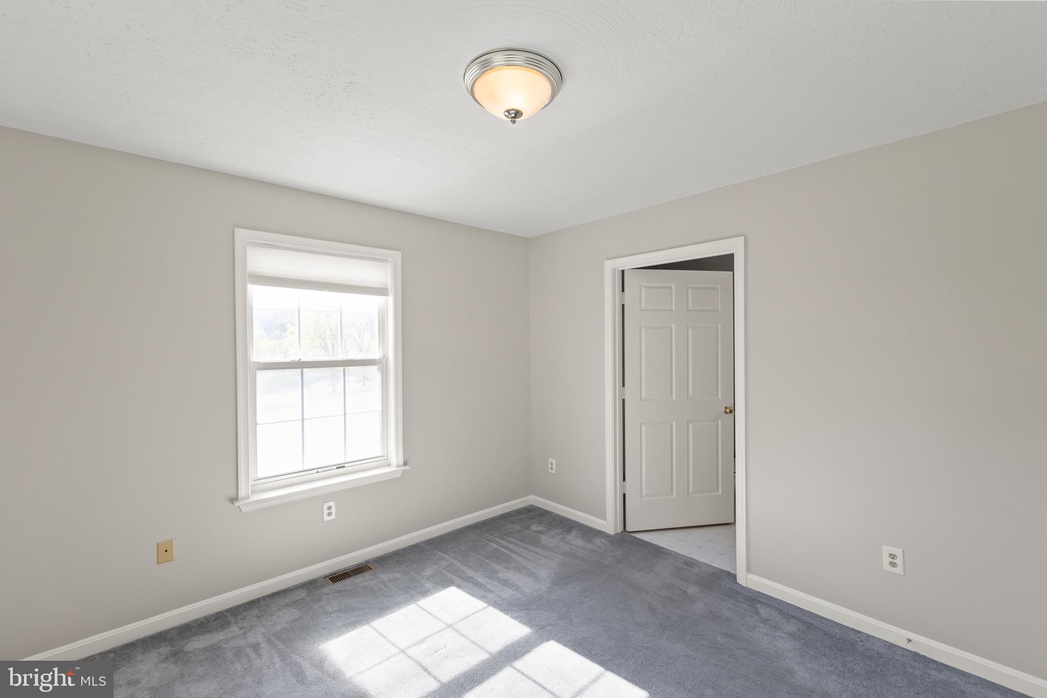 1039 Hiatt Road Clear Brook, VA 22624 - Photo 36 of 55 an empty room with windows and closet