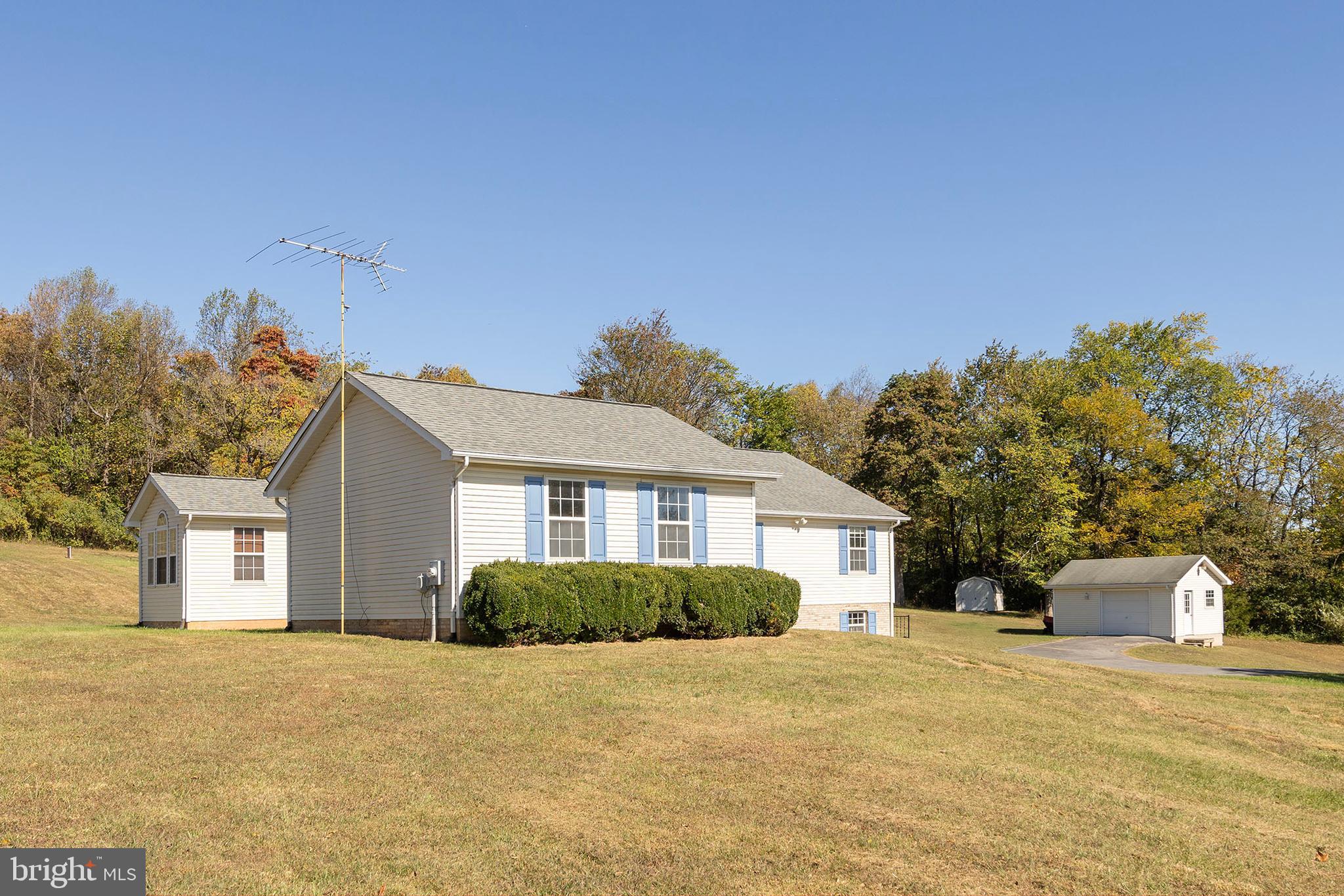 1039 Hiatt Road Clear Brook, VA 22624 - Photo 50 of 55 a front view of house with yard and trees in the background