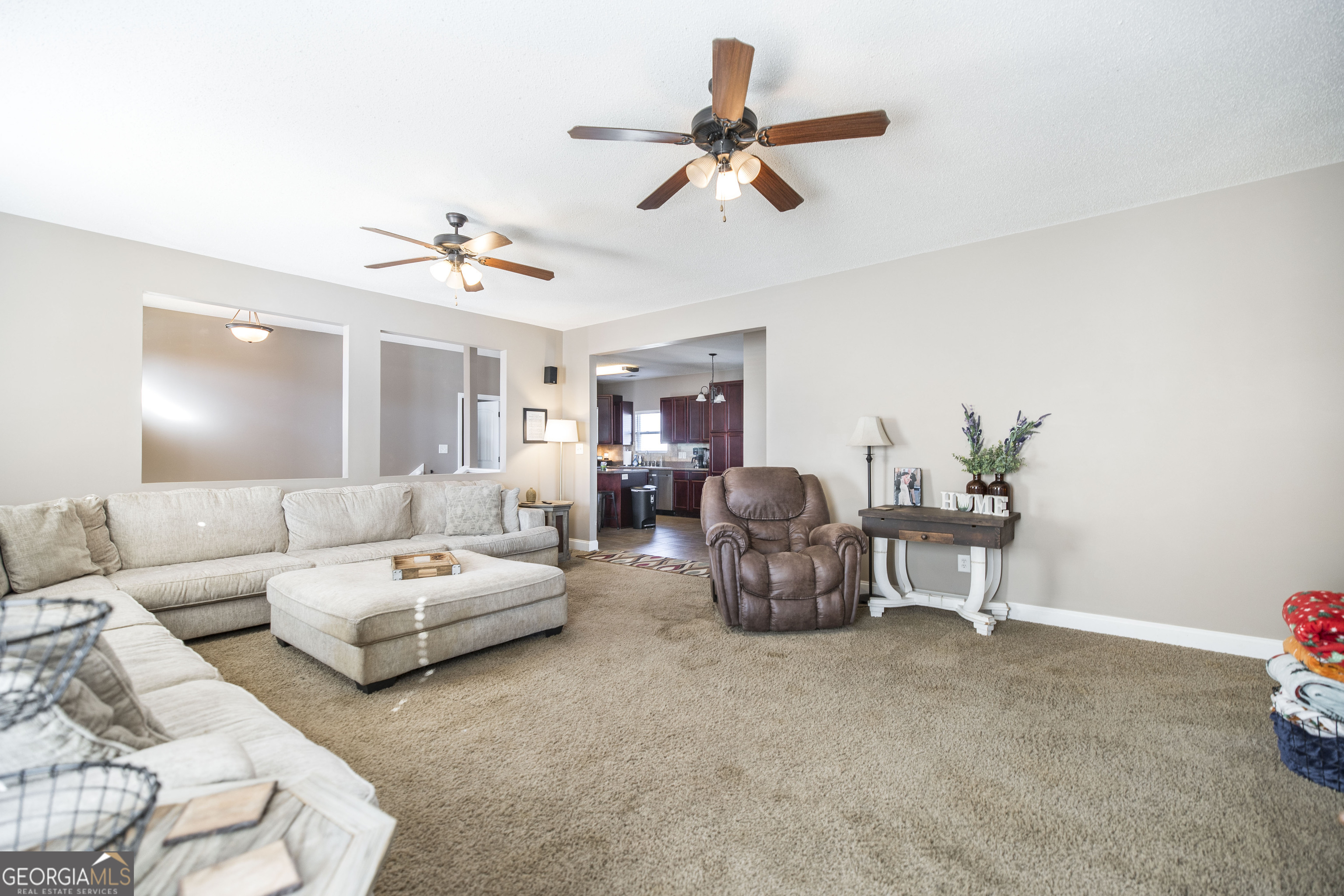 303 Rose Pointe Court Bonaire, GA 31005 - Photo 13 of 31 a living room with furniture and a ceiling fan