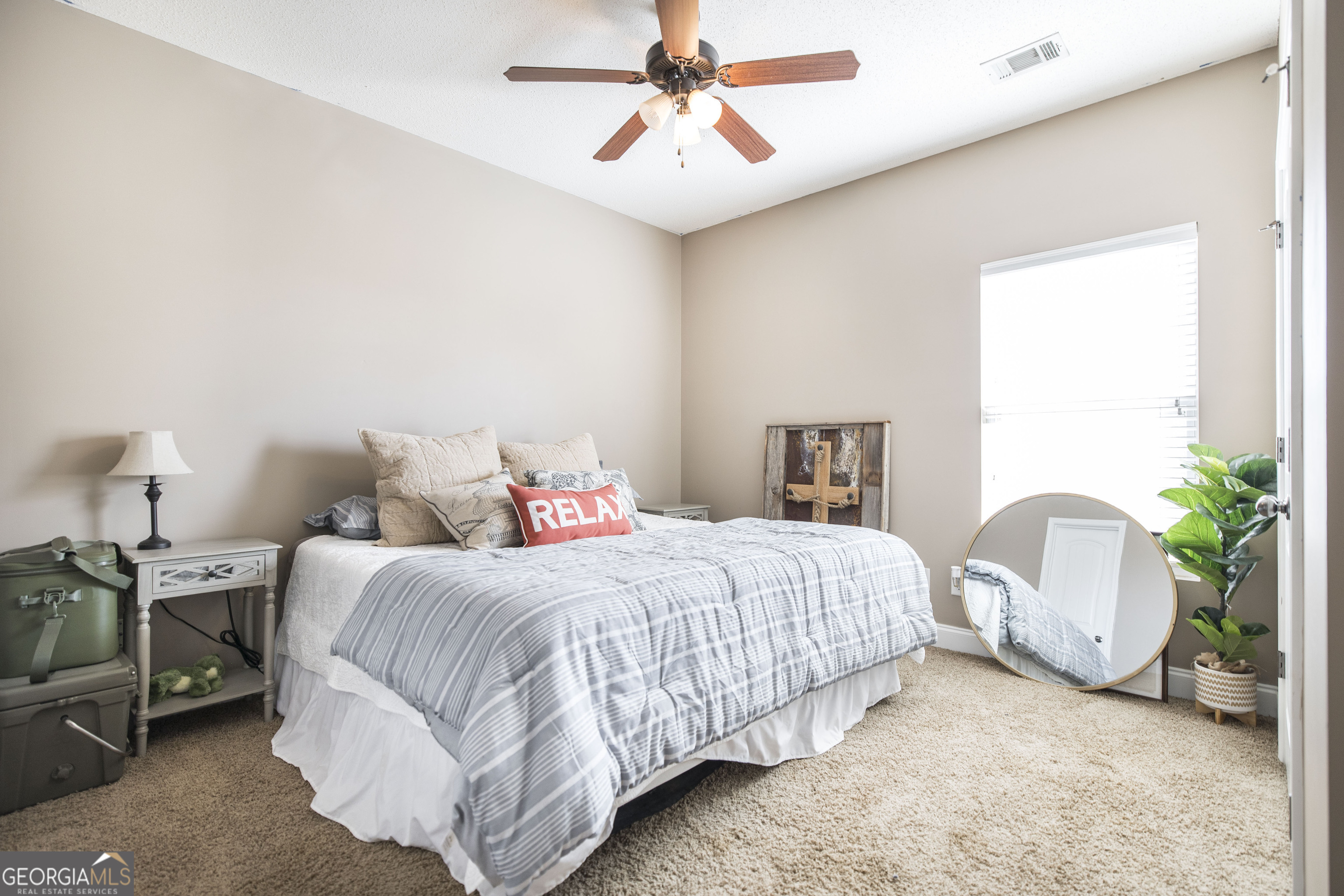 303 Rose Pointe Court Bonaire, GA 31005 - Photo 15 of 31 a bedroom with a bed and a chandelier