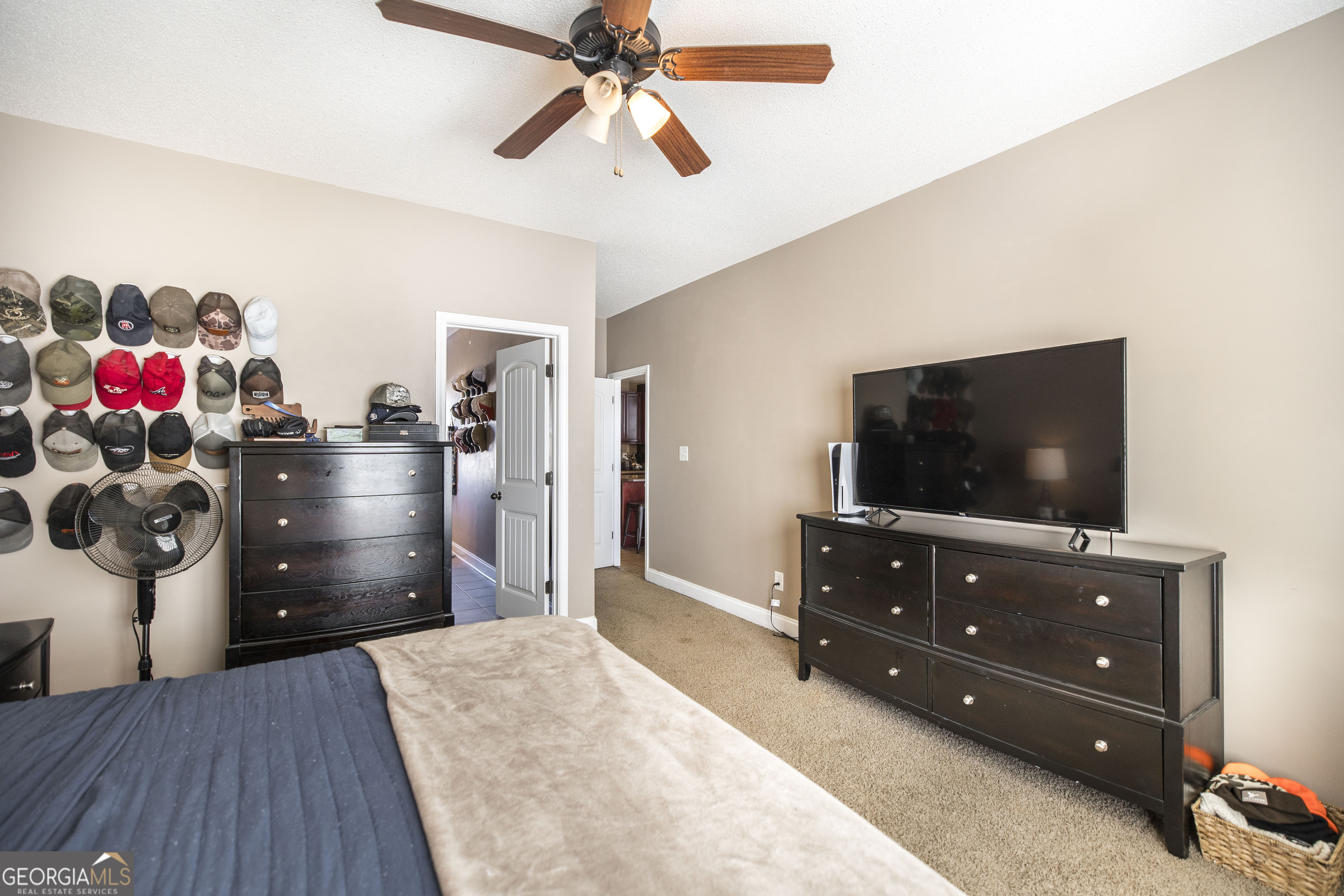 303 Rose Pointe Court Bonaire, GA 31005 - Photo 18 of 31 a living room with a cabinet and a flat screen tv