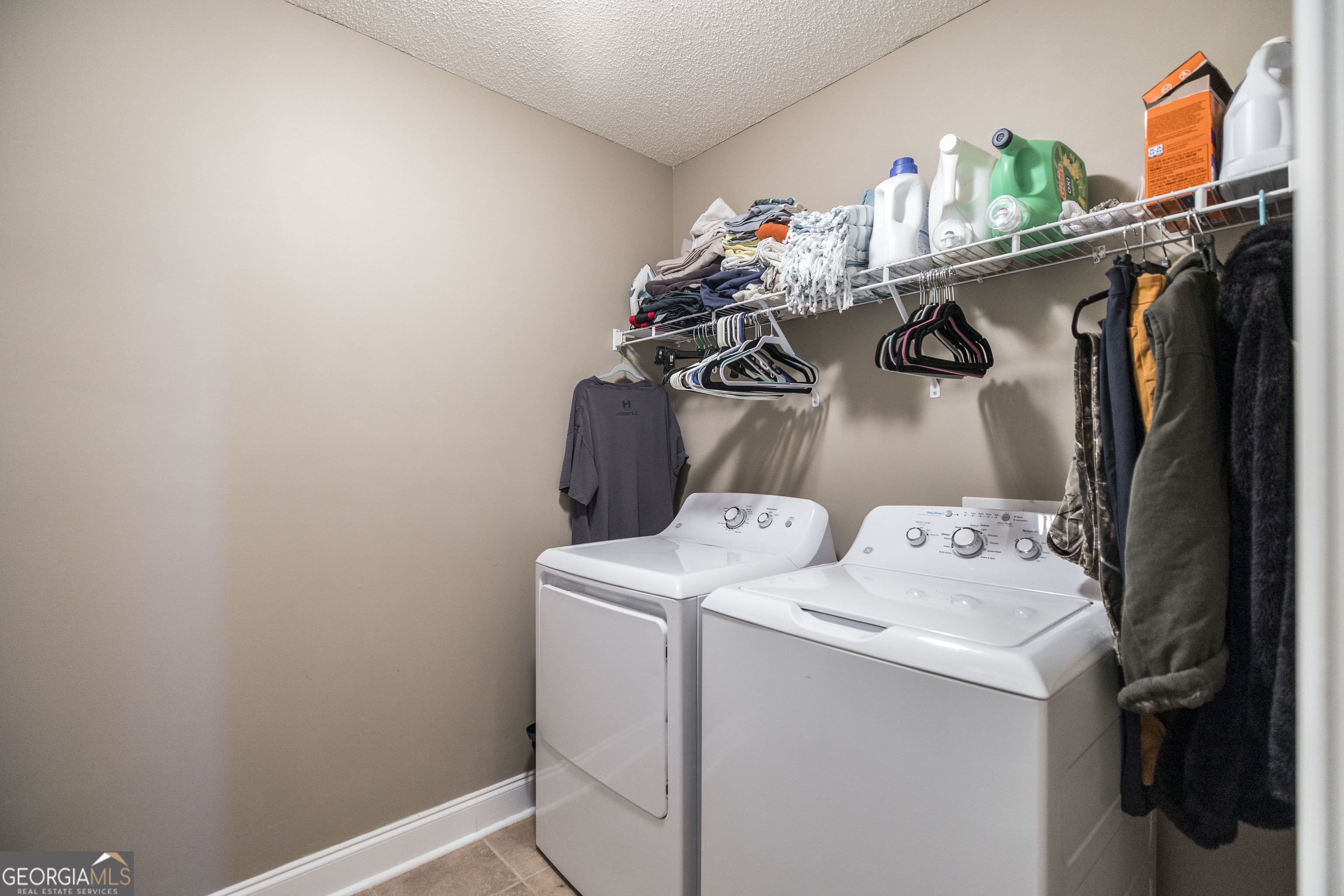 303 Rose Pointe Court Bonaire, GA 31005 - Photo 27 of 31 a utility room with dryer and washer