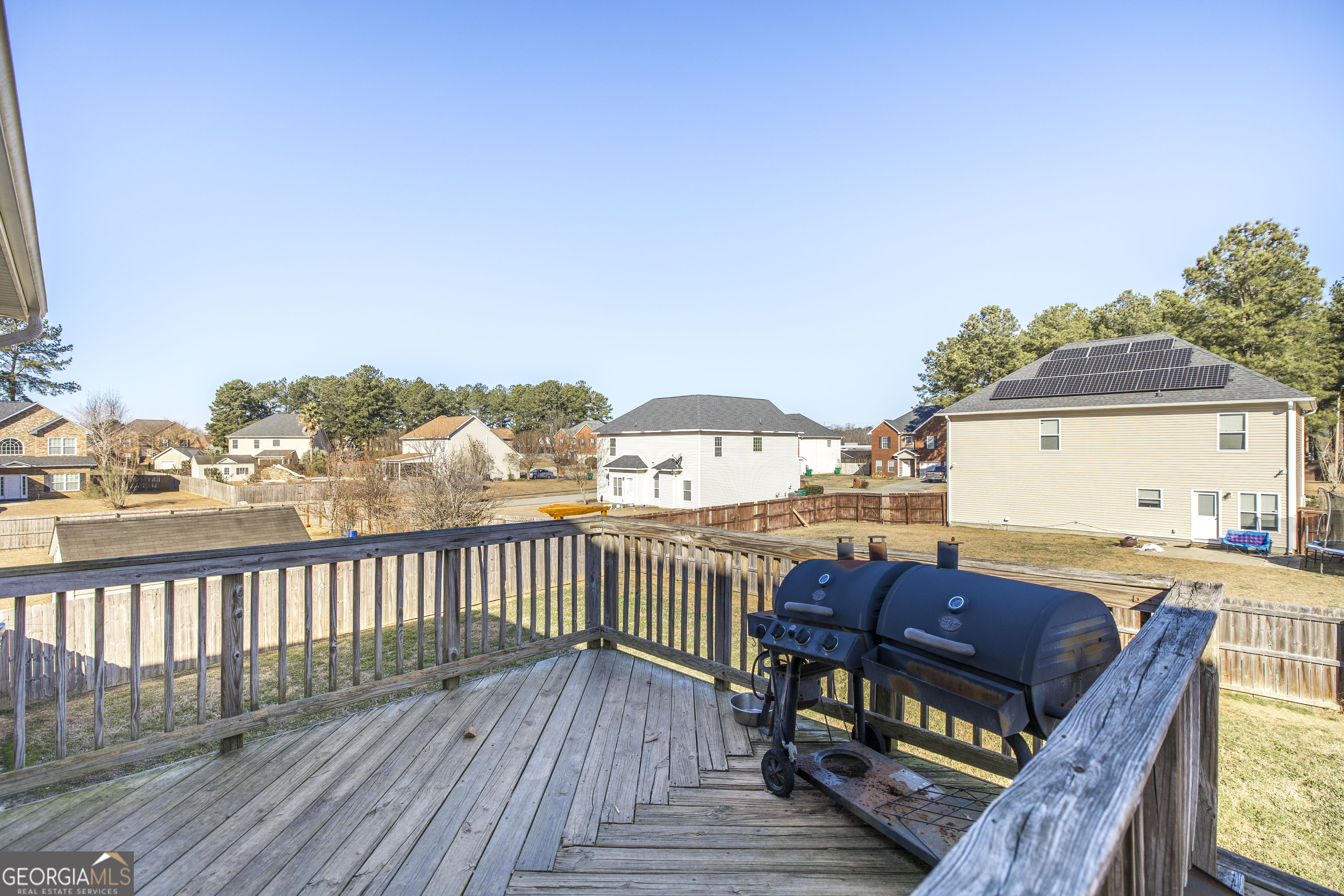 303 Rose Pointe Court Bonaire, GA 31005 - Photo 31 of 31 a view of a balcony with wooden floor and outdoor seating