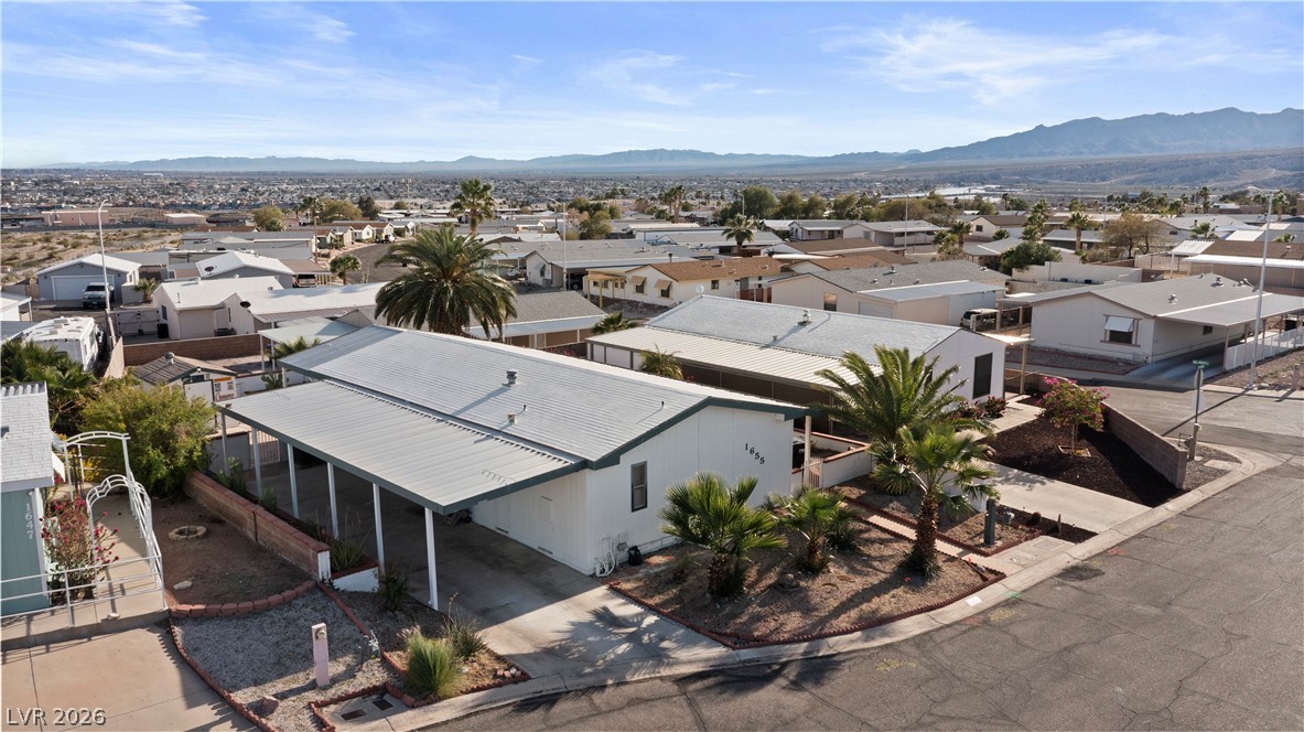 1655 Granada Street Laughlin, NV 89029 - Photo 62 of 76 Aerial view of residential area featuring a mountain backdrop
