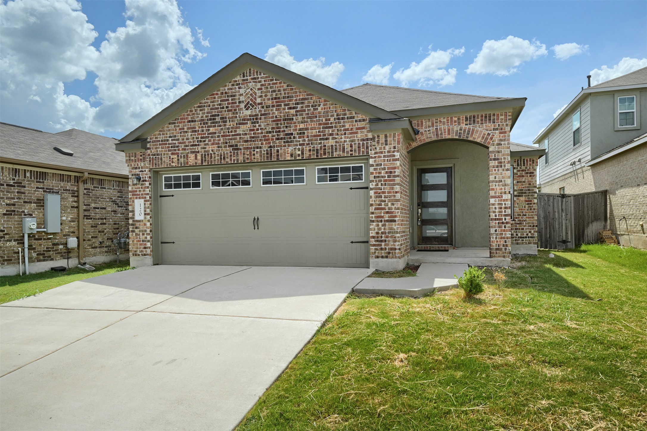 120 Milliner Loop Hutto, TX 78634 - Photo 1 of 15 Brick facade and an arched entry welcome you to this charming single-story residence.